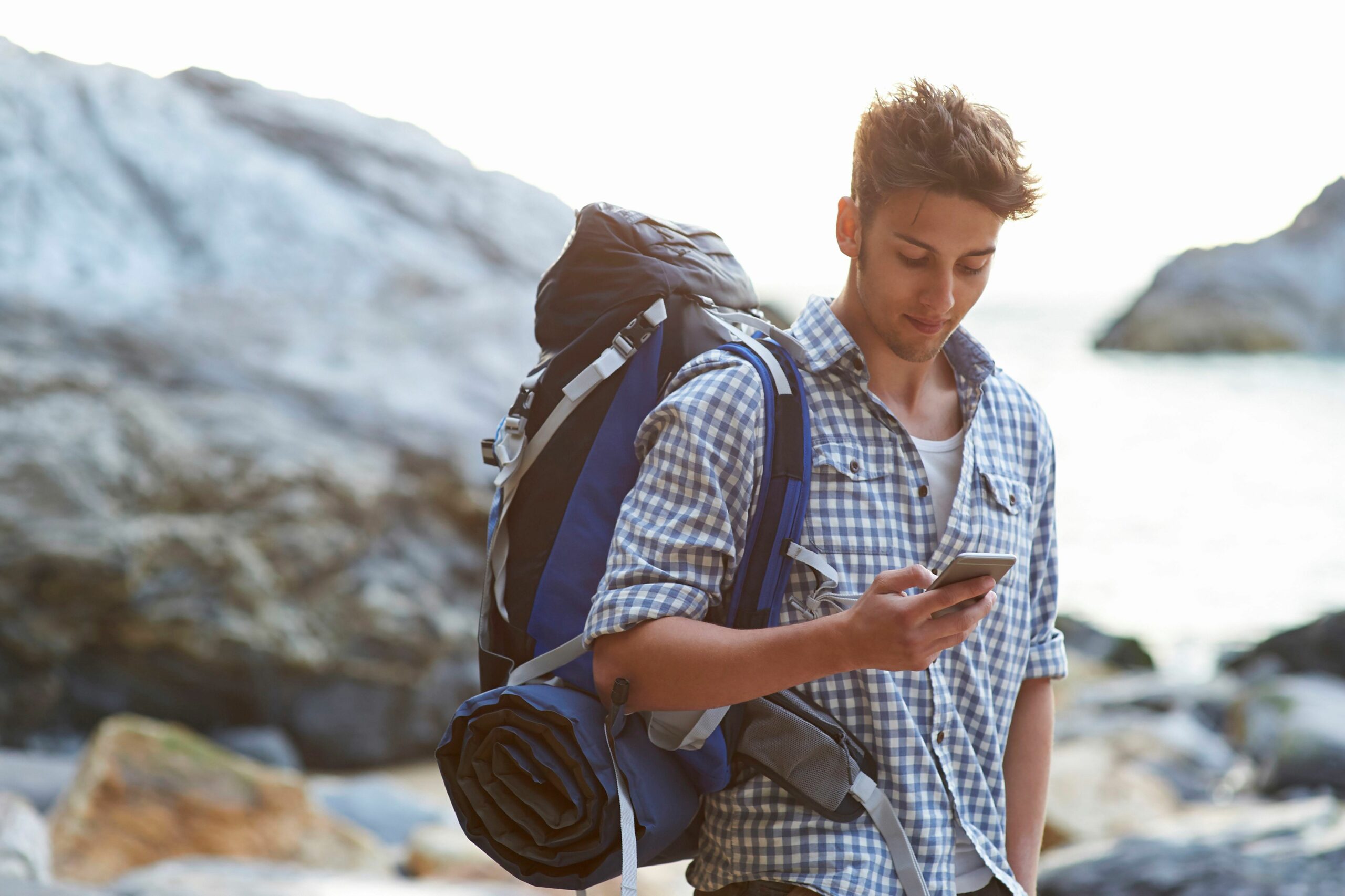 hiker using mobile phone on rocky beach 562732531 5b86e44d46e0fb002533137d 811313a67f6f4160a1602f2797bf4894 scaled