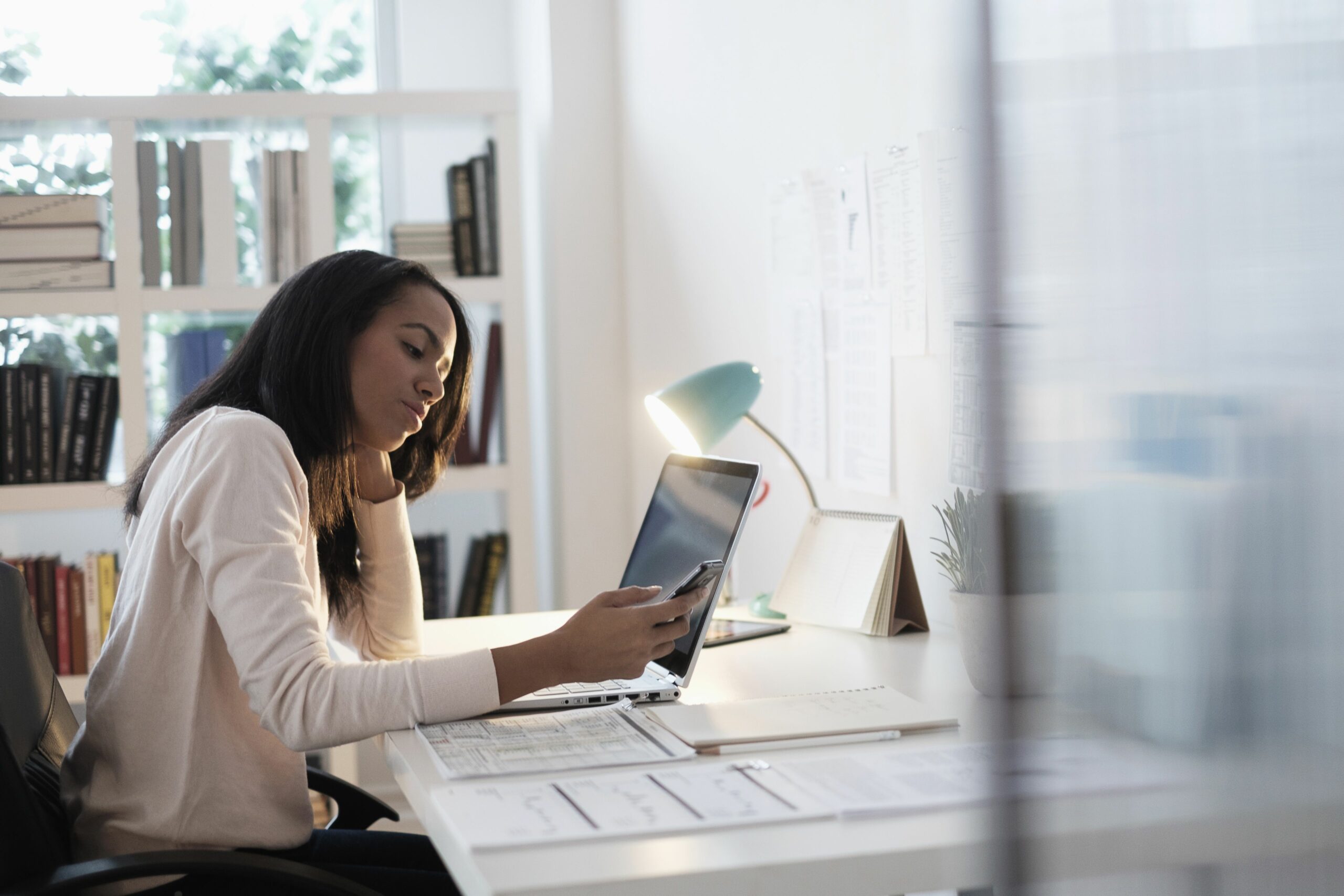 mixed race businesswoman using cell phone 606353283 5b216086eb97de0036cb09f3 scaled