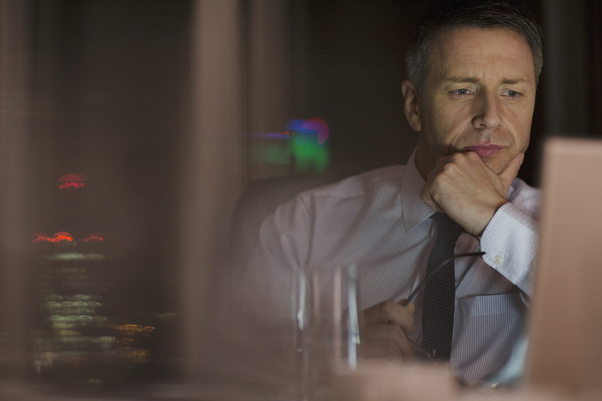 pensive businessman working late at laptop in office 500796897 5a84e2038e1b6e00367c08ca scaled