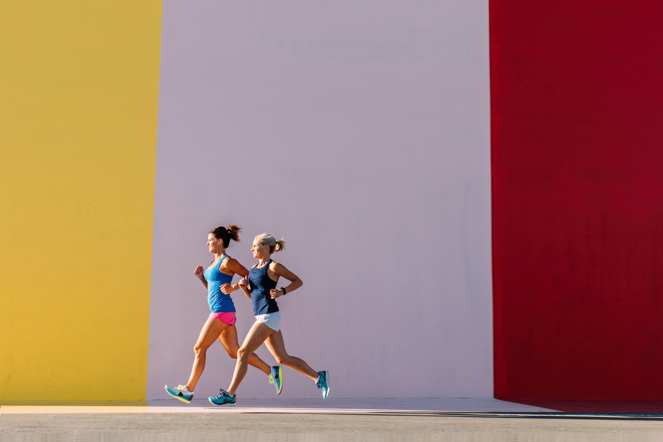 Womenrunningagainstcolorfulwall 5f0af0ecdcda4b4a8aeb8f66af715747