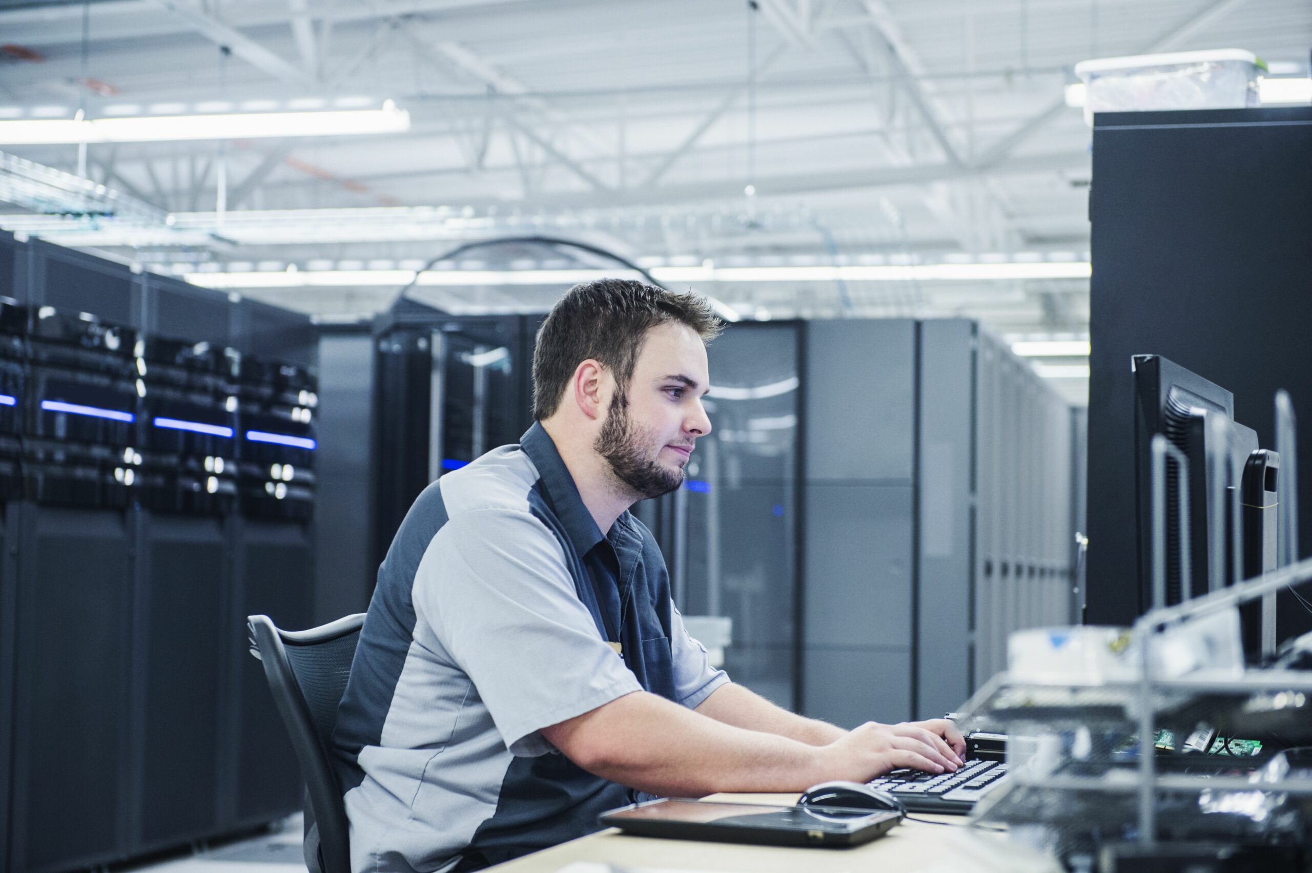 caucasian technician using computer in server room 533765037 5733442c3df78c6bb06c716d scaled