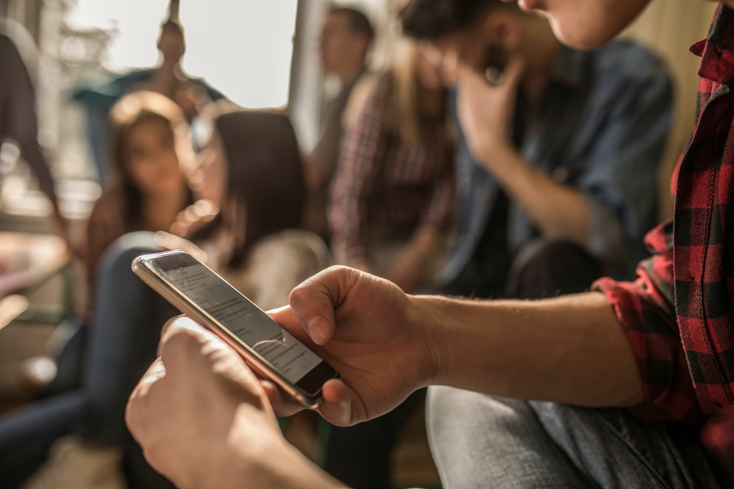 close up of unrecognizable student using cell phone on a break in the classroom 875179478 5be6063cc9e77c005246bda2 scaled