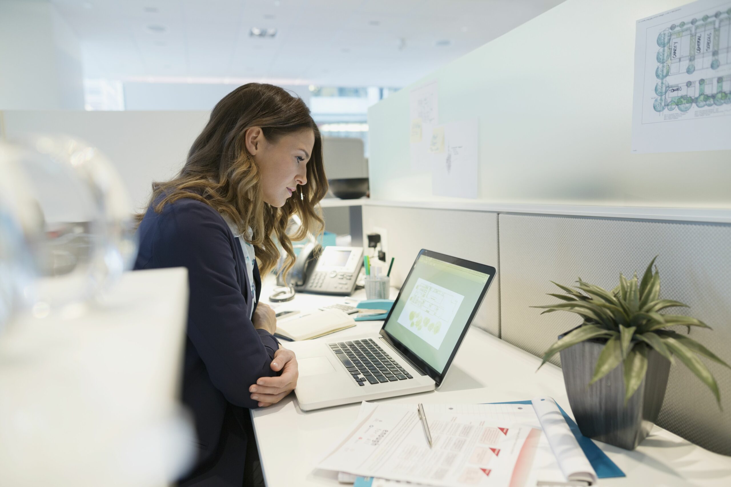 focused young businesswoman working at laptop office 609179095 57b605bb3df78c69096b1a1a scaled