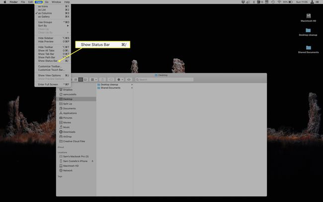 Finder, jossa on Näytä-valikko ja Näytä tilapalkki -valikkovaihtoehto.