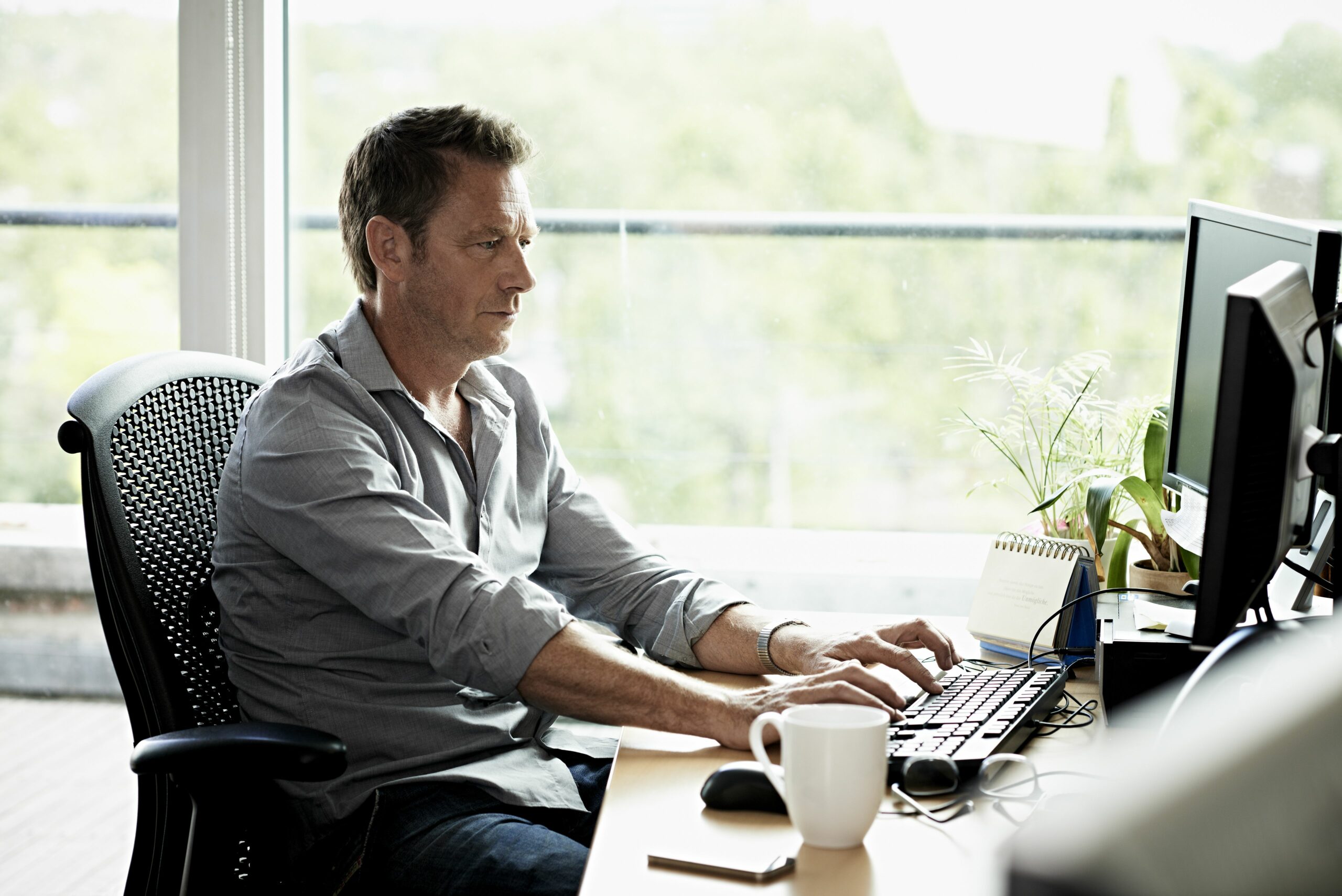 business man working on computer 475967873 57524b7f5f9b5892e8f26fc7 scaled