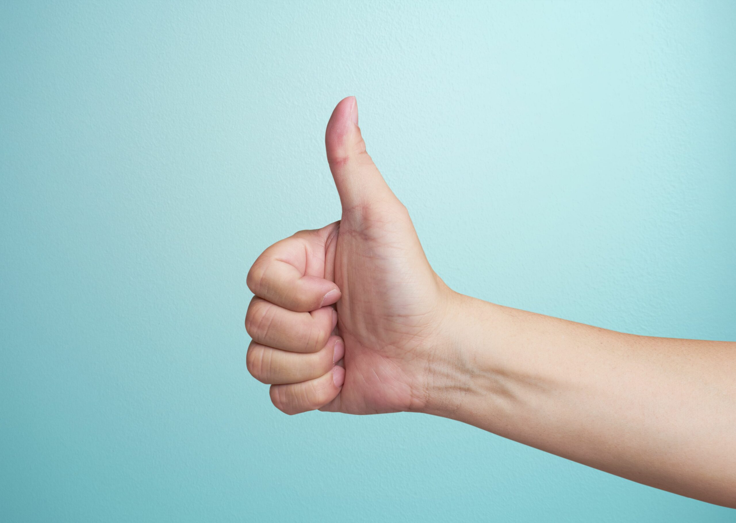 cropped hand of woman gesturing against blue background 914705824 5b390fb5c9e77c001aaeb64c scaled