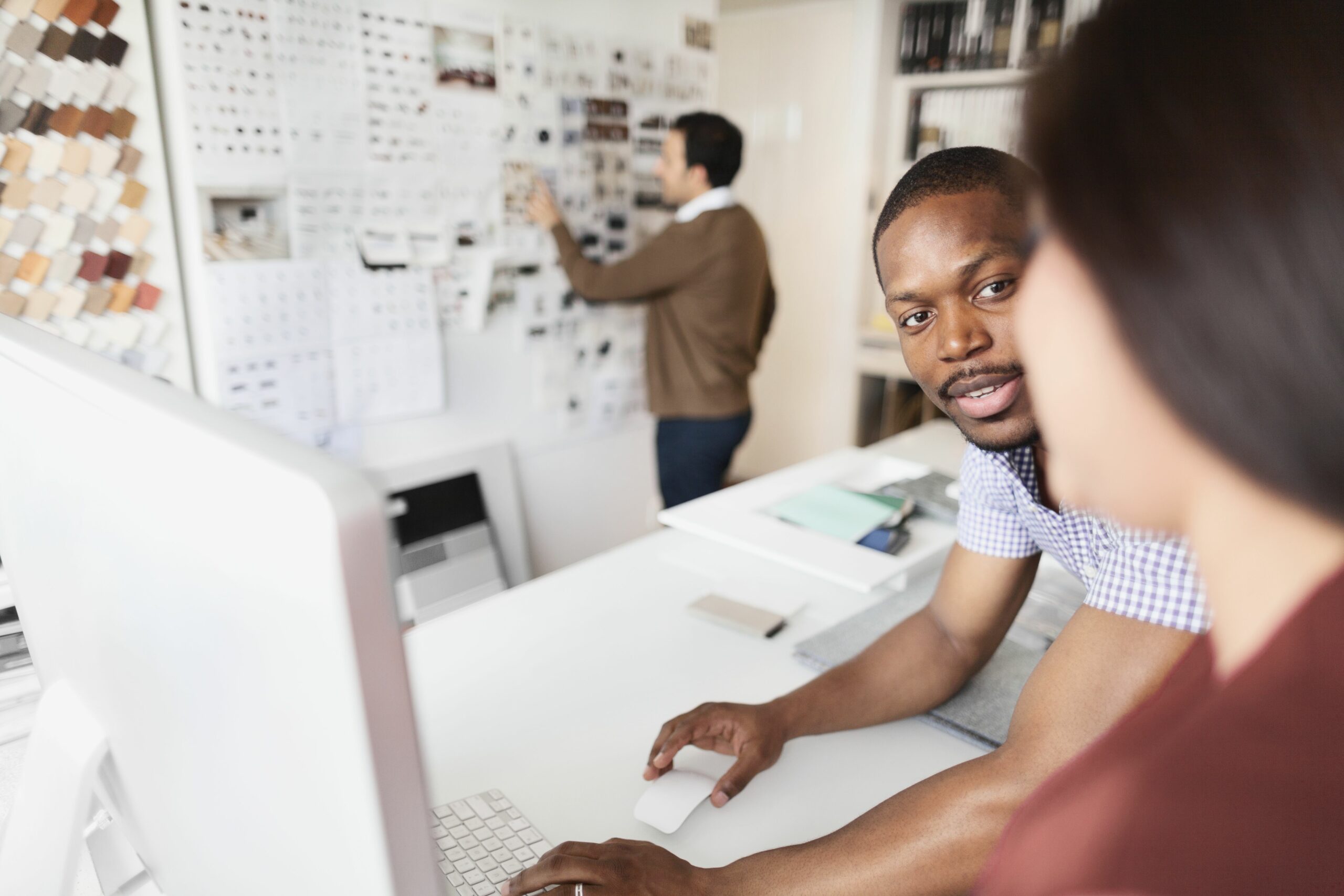 designers reviewing ideas on desktop computer 678267687 59cbb2c022fa3a0011890dc6 scaled