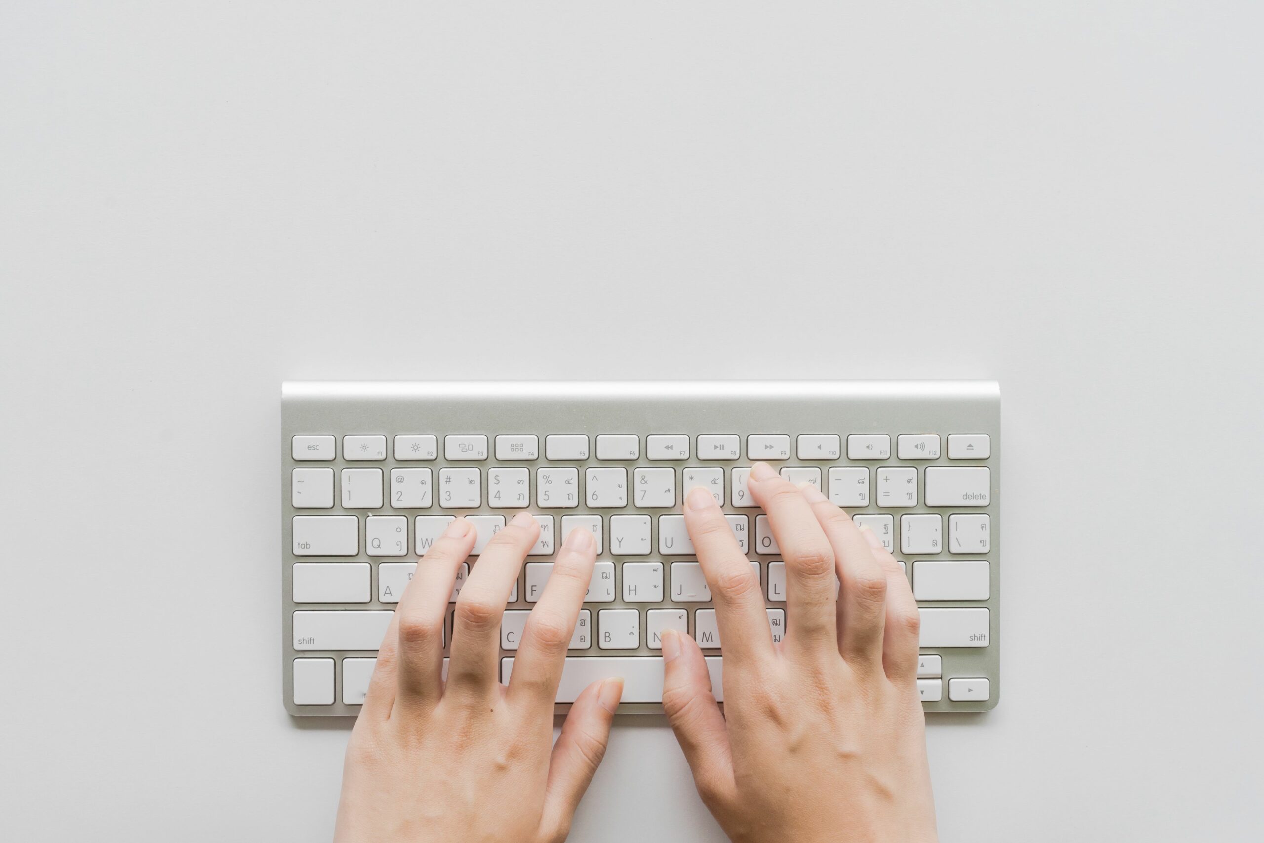 directly above shot of person hands typing on computer keyboard 928363760 5af0f619a18d9e0037628376 scaled