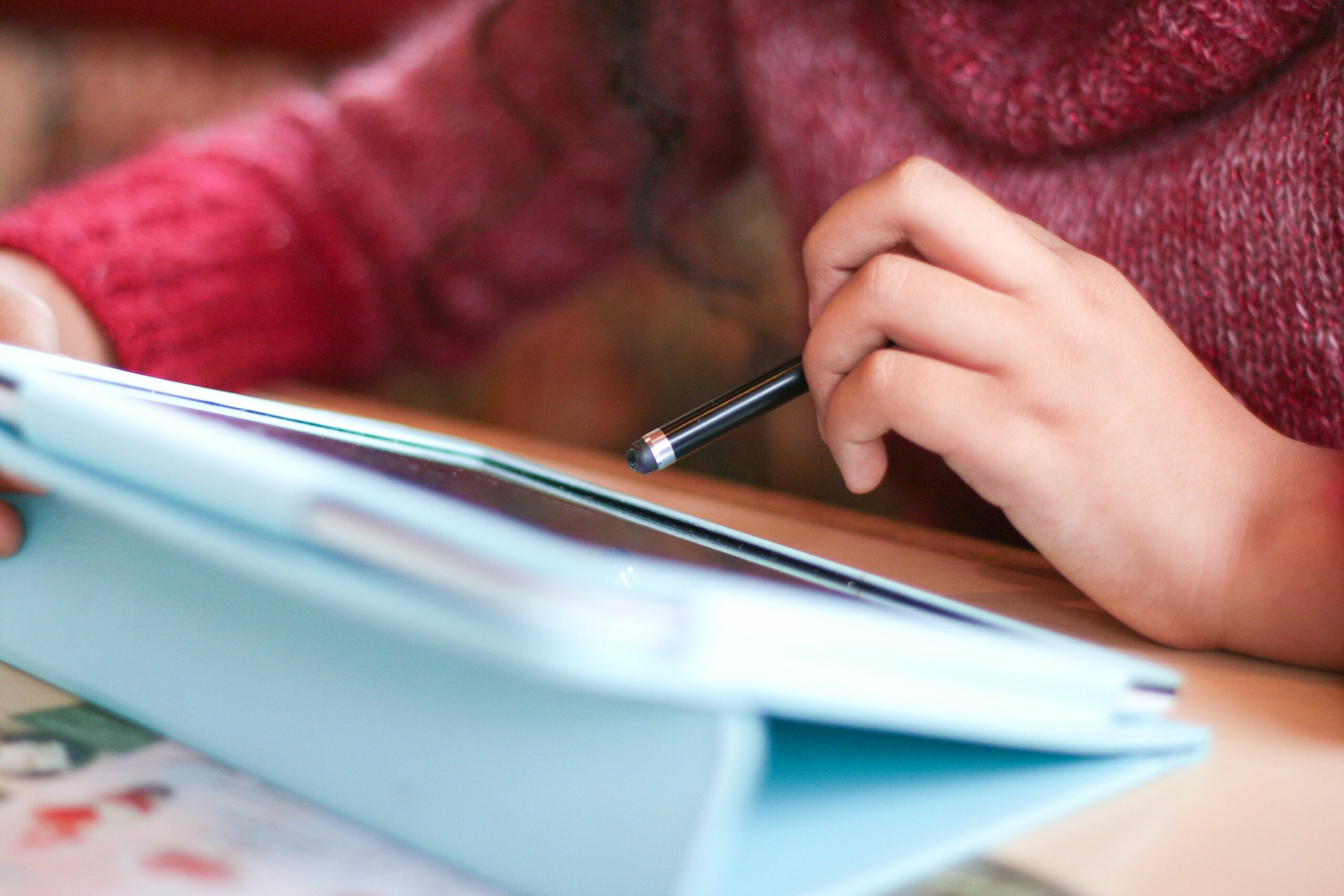 girl s hand and tablet 468222793 5c1718a446e0fb0001d793a8 scaled