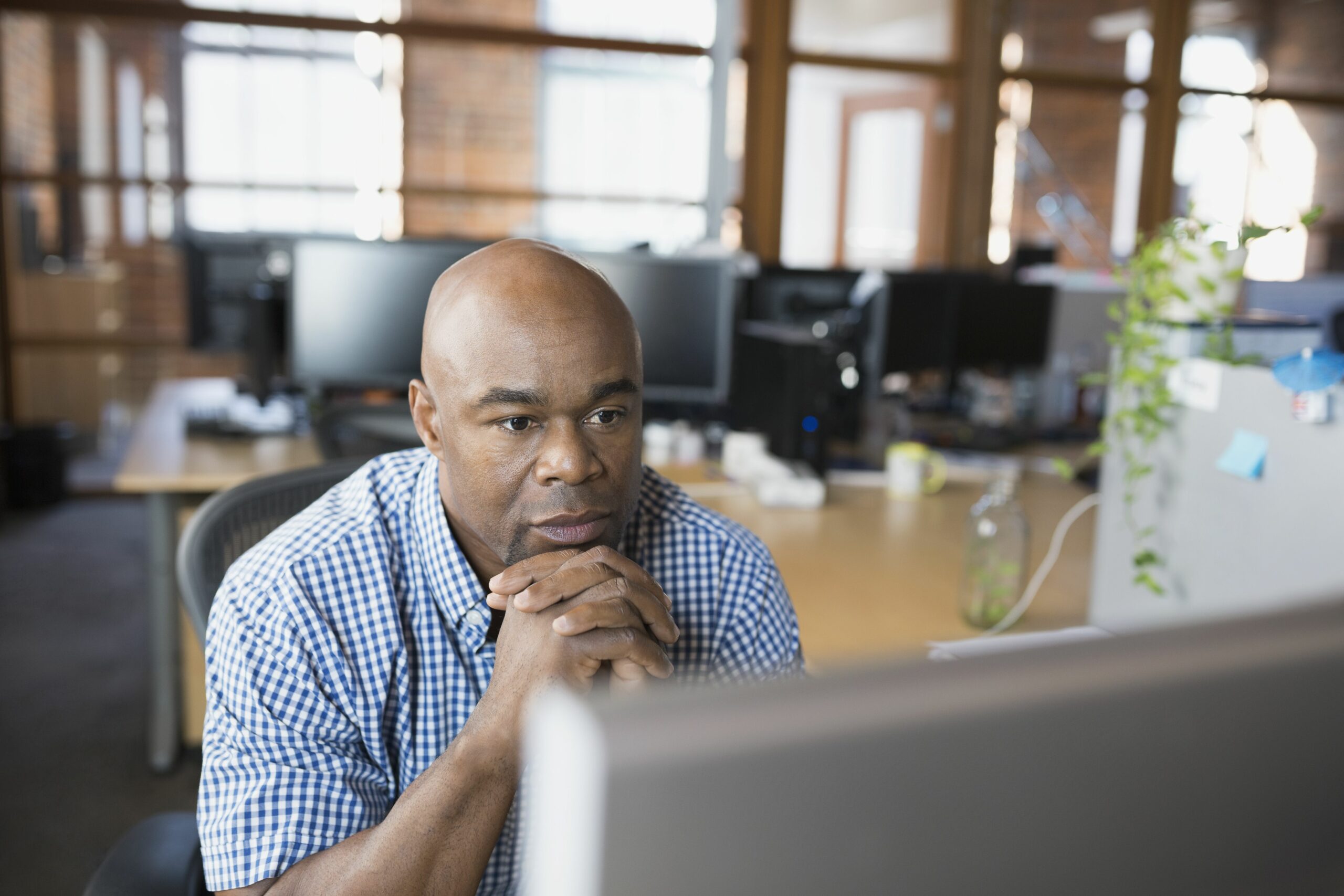 serious businessman working at computer in office 595346543 57b60abd3df78c69096b2eca scaled