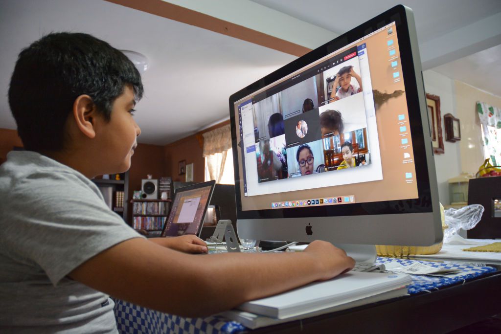 boy in class over internet 2495b17274e545e38306fab2794d5875