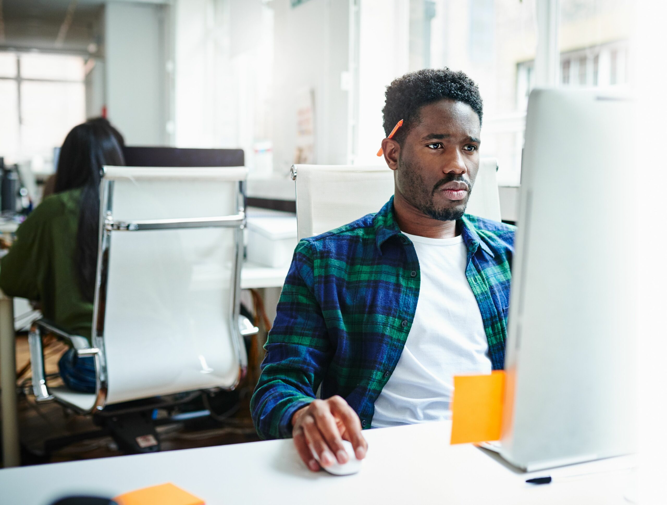 businessman at workstation in modern office 561609617 5a3415faec2f64003777aaf4 scaled