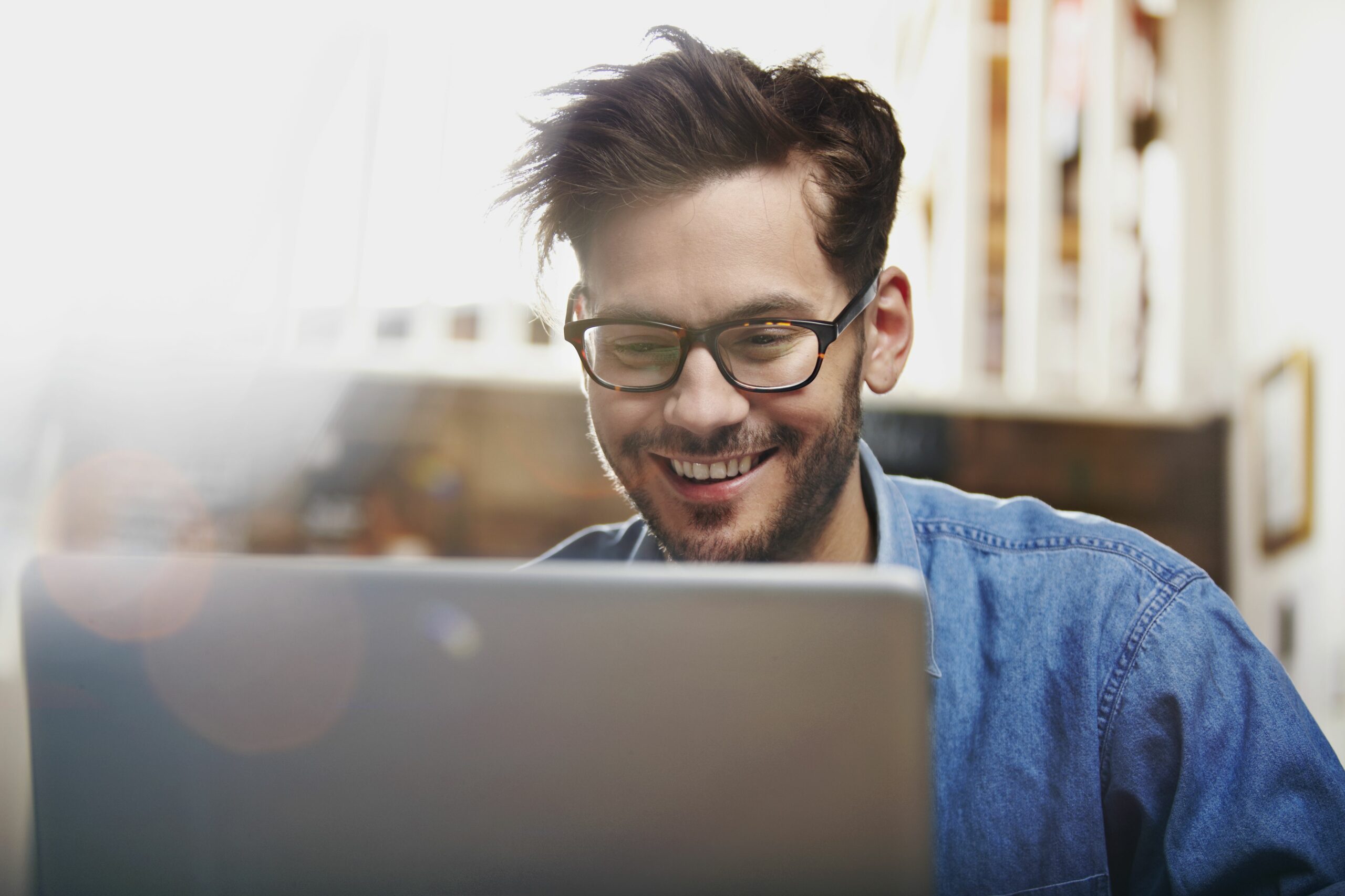 man working on a laptop in a coffee shop 174457231 57aa0b475f9b58974a856536 scaled