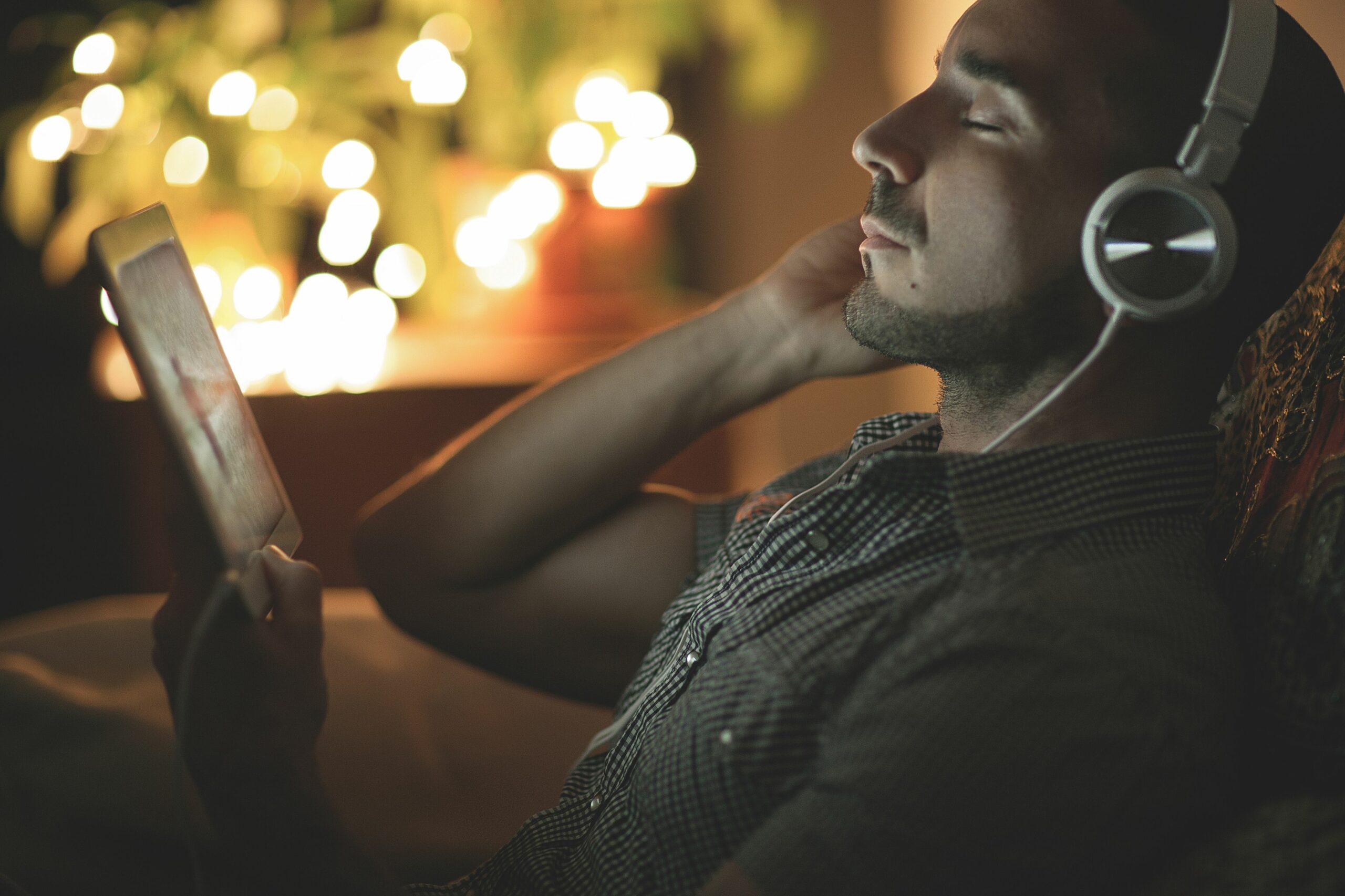 relaxed man listening to music at home at night 465863031 57a211d33df78c3276d69518 scaled