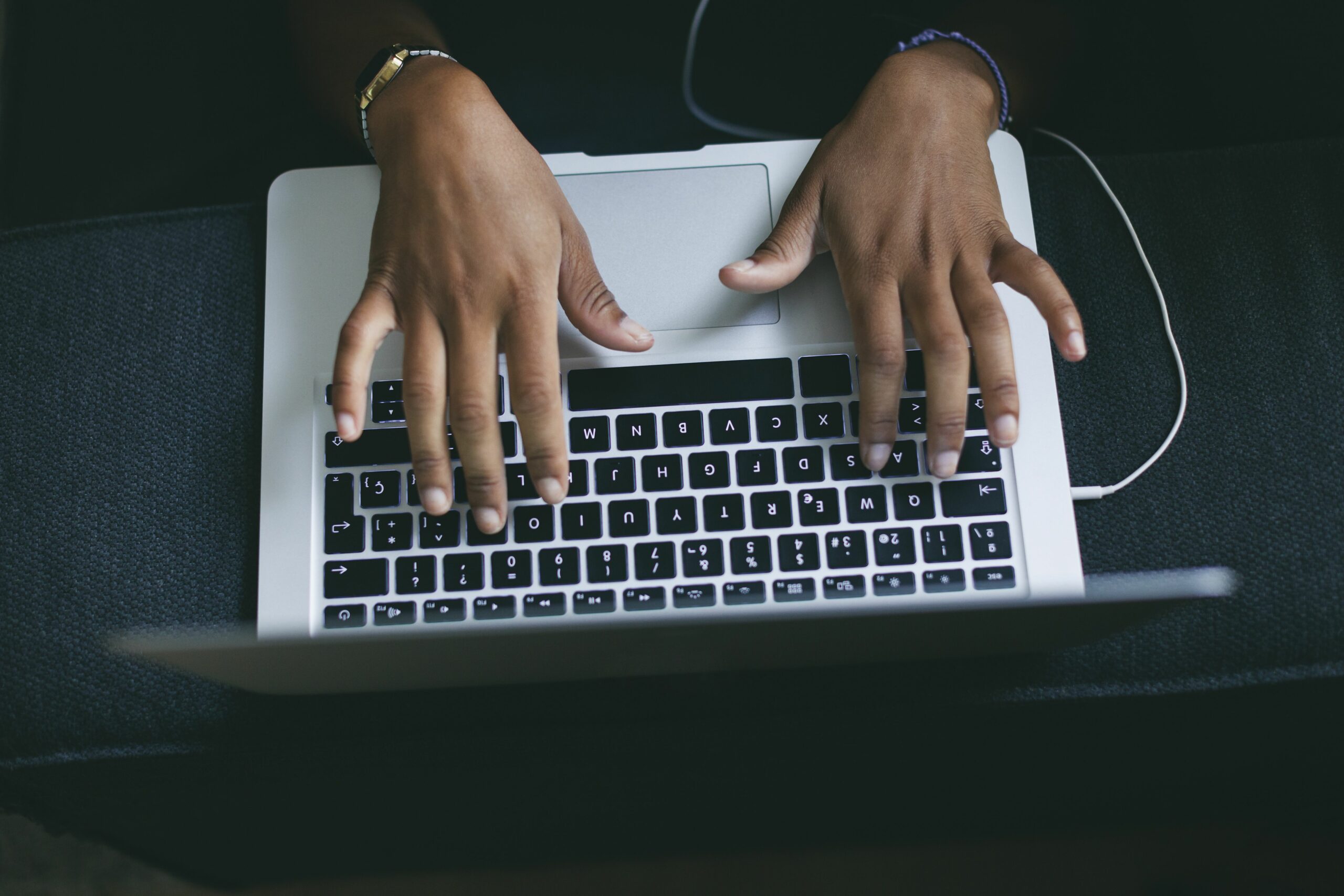 womans hand typing on keyboard of laptop 591212551 582525c45f9b58d5b117e605 scaled