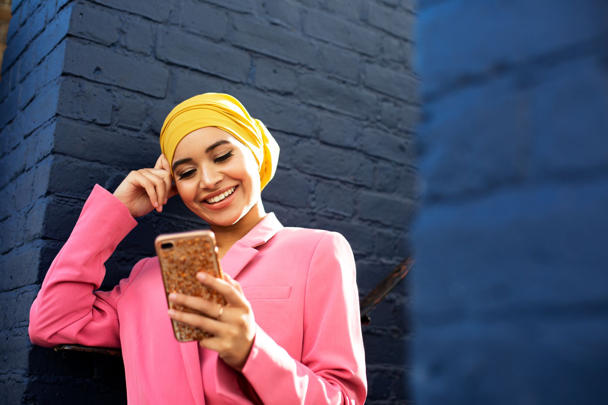 young muslim woman using phone 1137305438 75947aa7fb484506bf9da8c38fc68a03