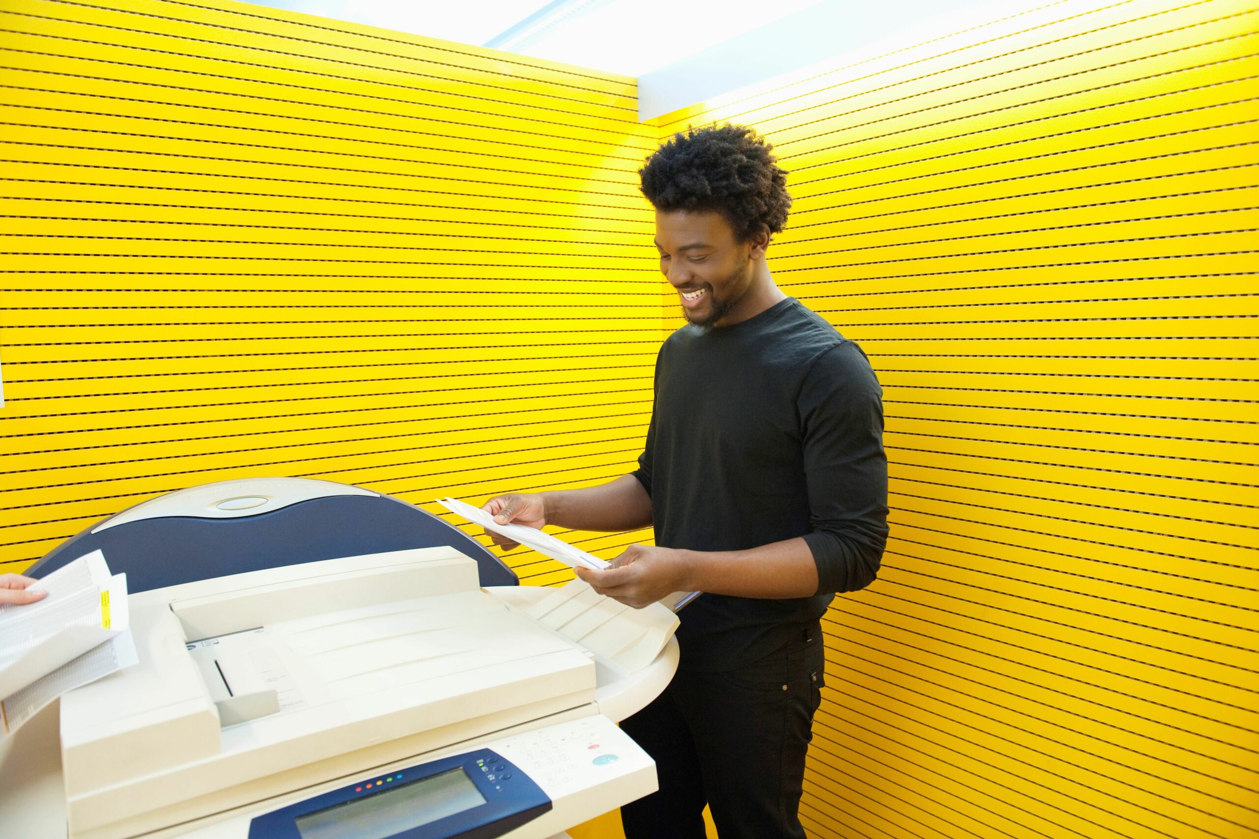 businessman using a photocopy machine in an office 103059023 5bf37979c9e77c005108c703 d88af2c62aaa4845addf00b55b45f02e scaled