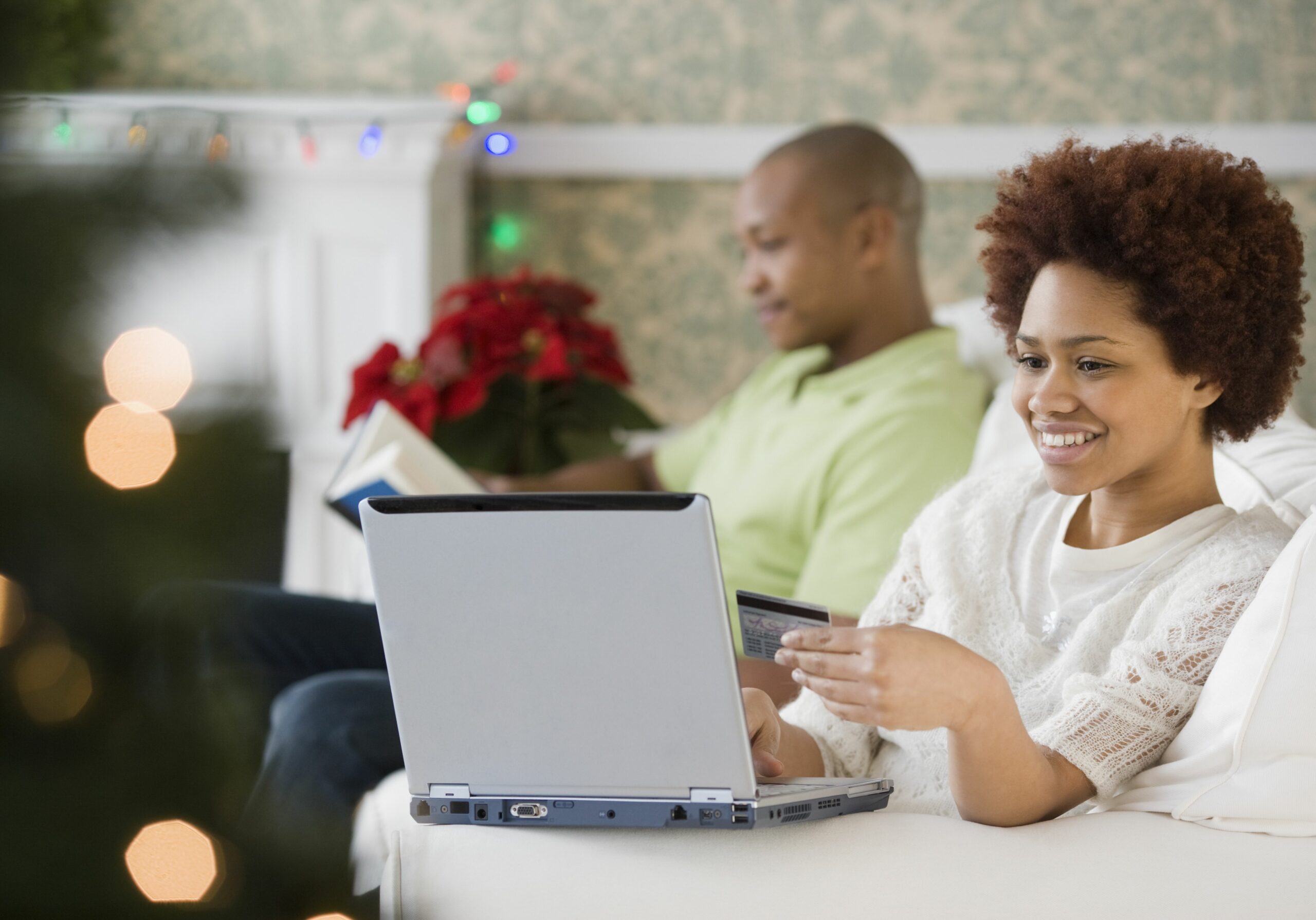 mixed race woman buying christmas presents online with credit card 84527986 582352235f9b58d5b1ea09cc scaled