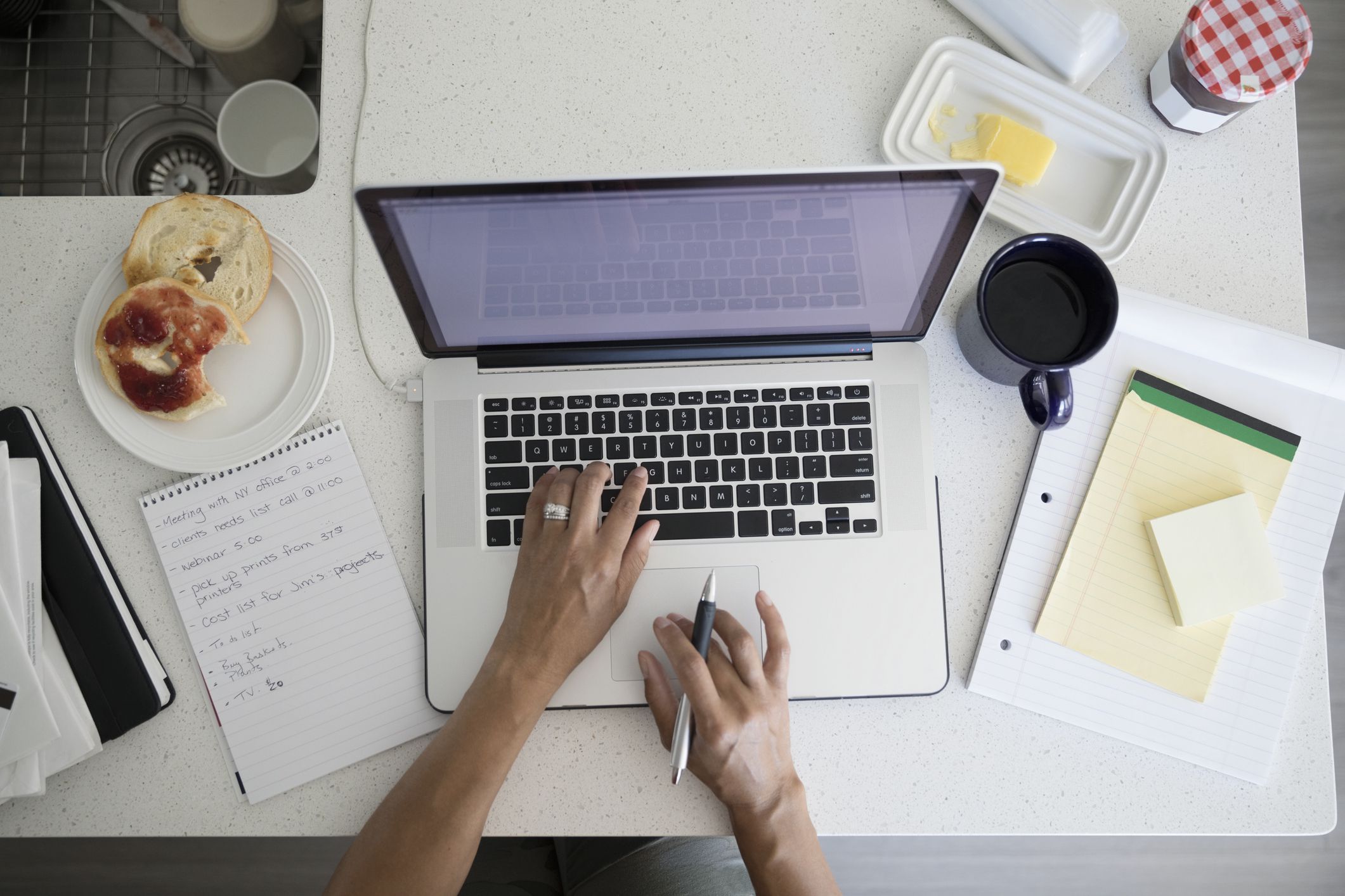 overhead view woman working at laptop at breakfast kitchen counter 753288519 ce50b21824f540b2a84b269d16d21140