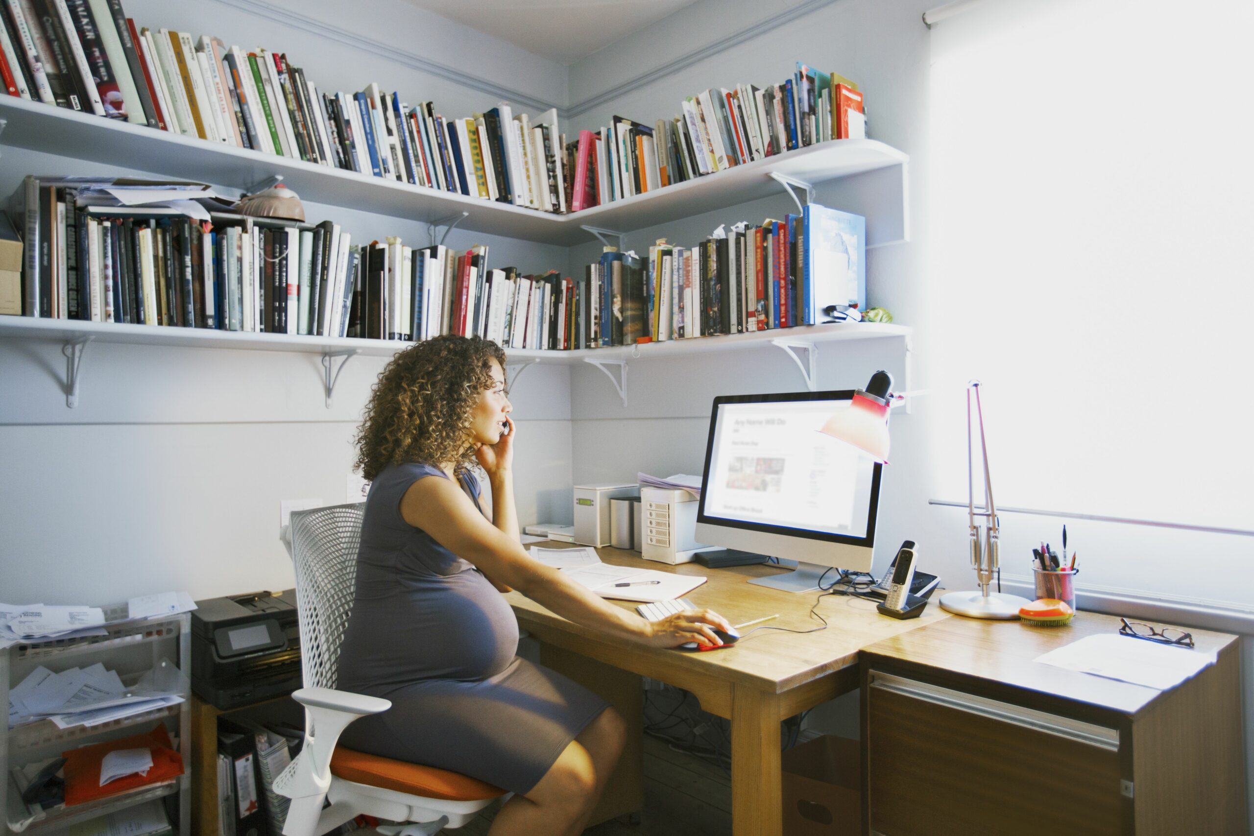 pregnant lady works from her home office 567613055 5a09ec4c494ec9003735d223 scaled