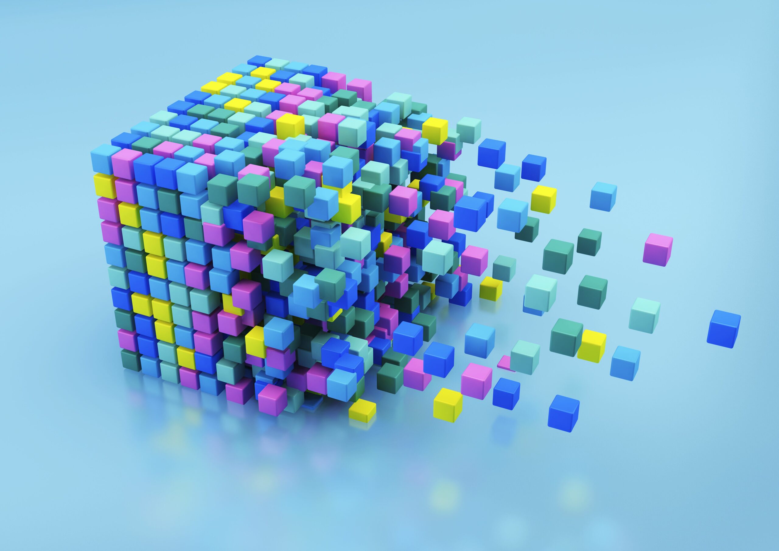 small multicolored blocks assembling in large cube shape on blue background 158318217 5ba2078446e0fb00503233da scaled