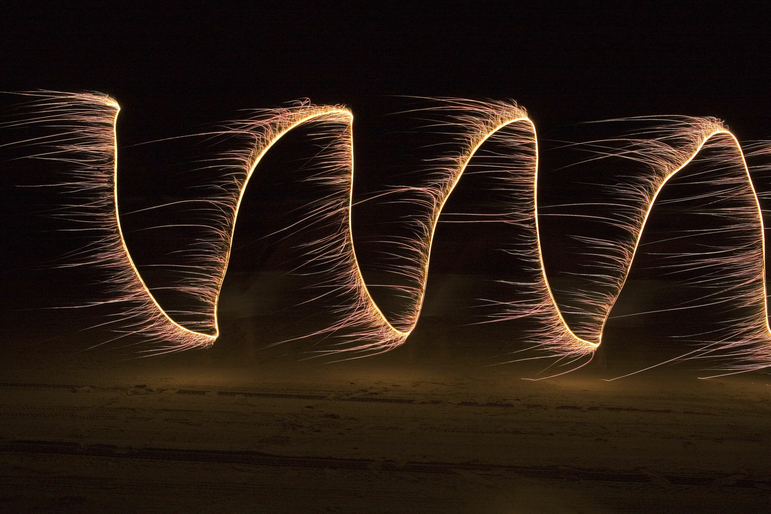 sparklers painting cosine at night on beach 200527708 001 5a5fb394842b170037a2d58f scaled