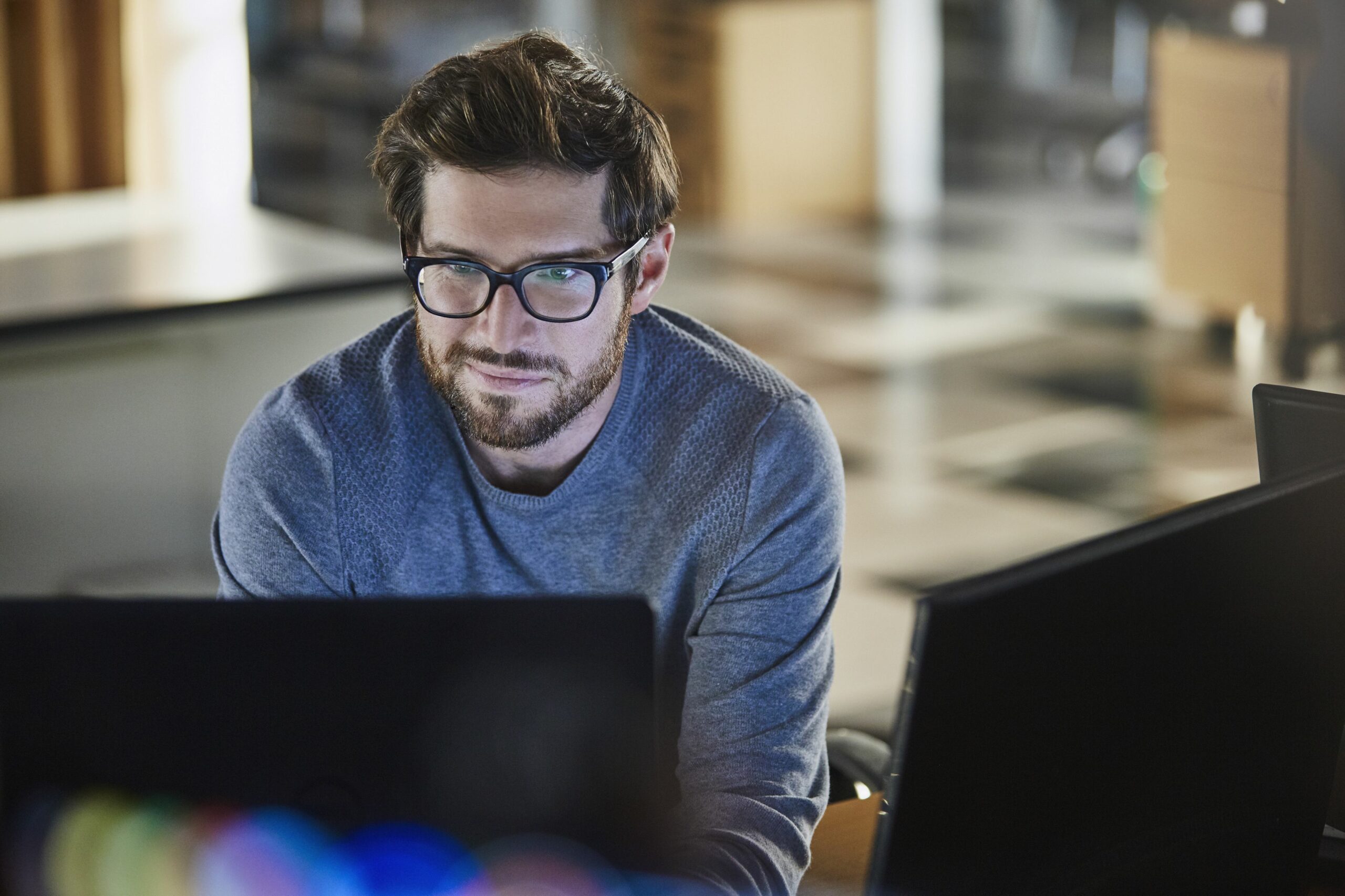 businessman working at computer in office 683749795 5a395fc17bb2830037526962 scaled