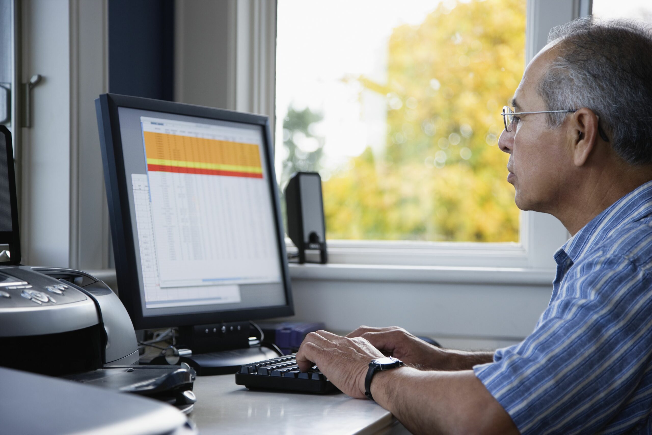 senior man using computer at home side view 200507722 001 5c23cc8746e0fb0001d22806 scaled