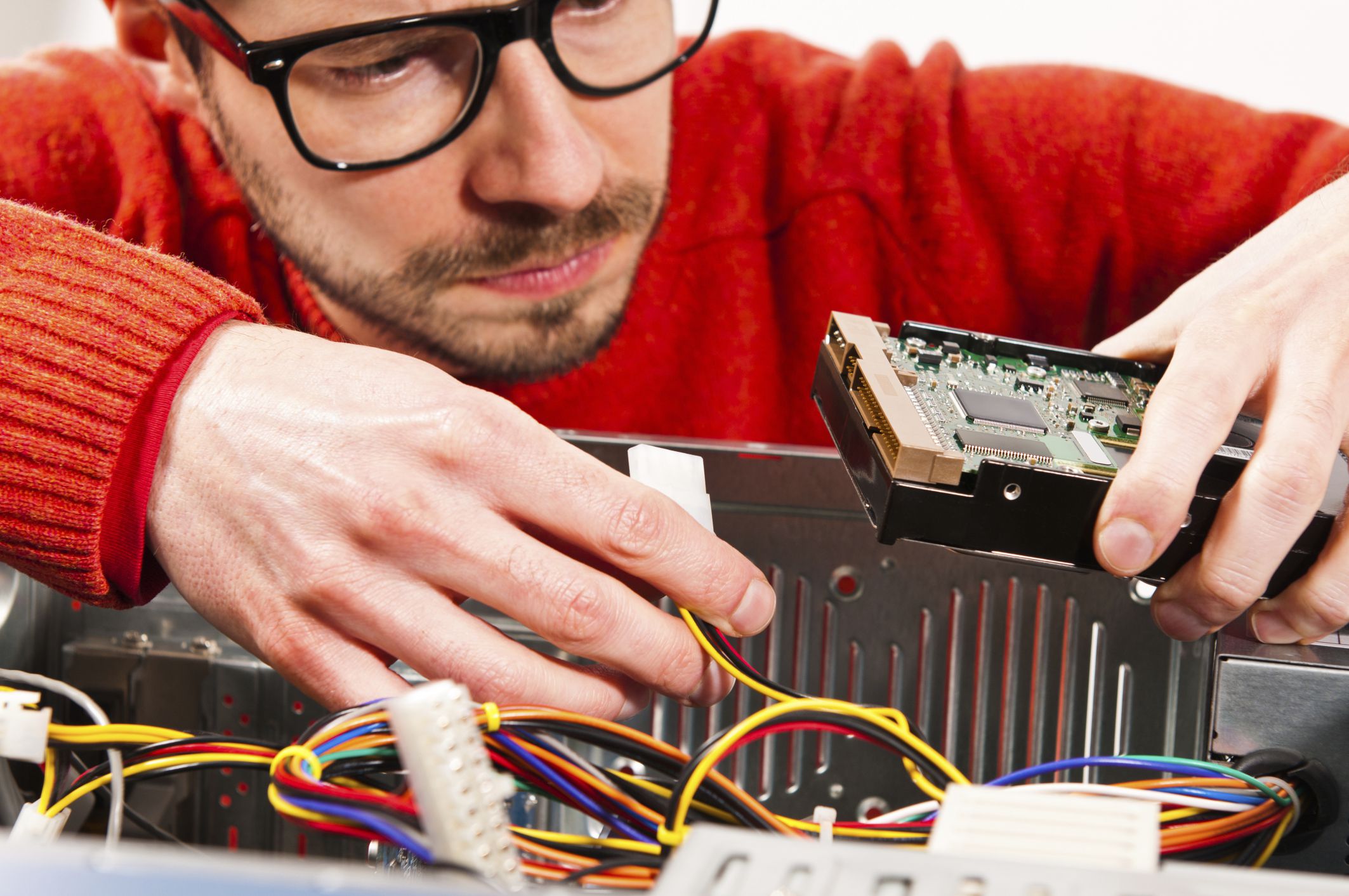 man fixing computer dominik pabis e plus getty images 56a6f9ea5f9b58b7d0e5cc98