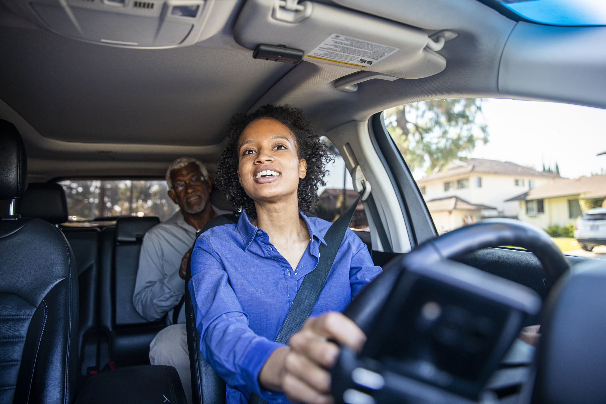 young black woman driving car for rideshare 1159637659 3590d274b993416a9f02eff08a16b48e