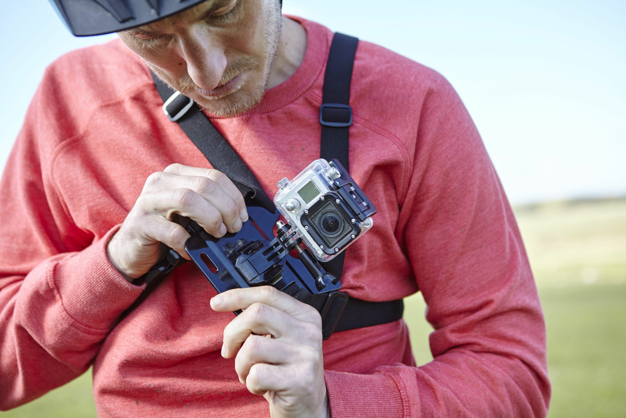 man attaching action camera to chest 664655587 5c8c2559c9e77c0001ac184b scaled