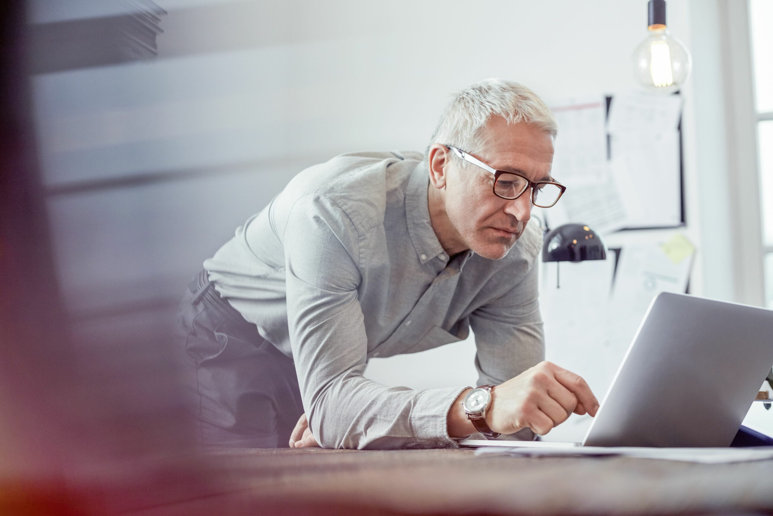 serious focused businessman working at laptop in office 742168511 5bfdb8e846e0fb005106b245 scaled