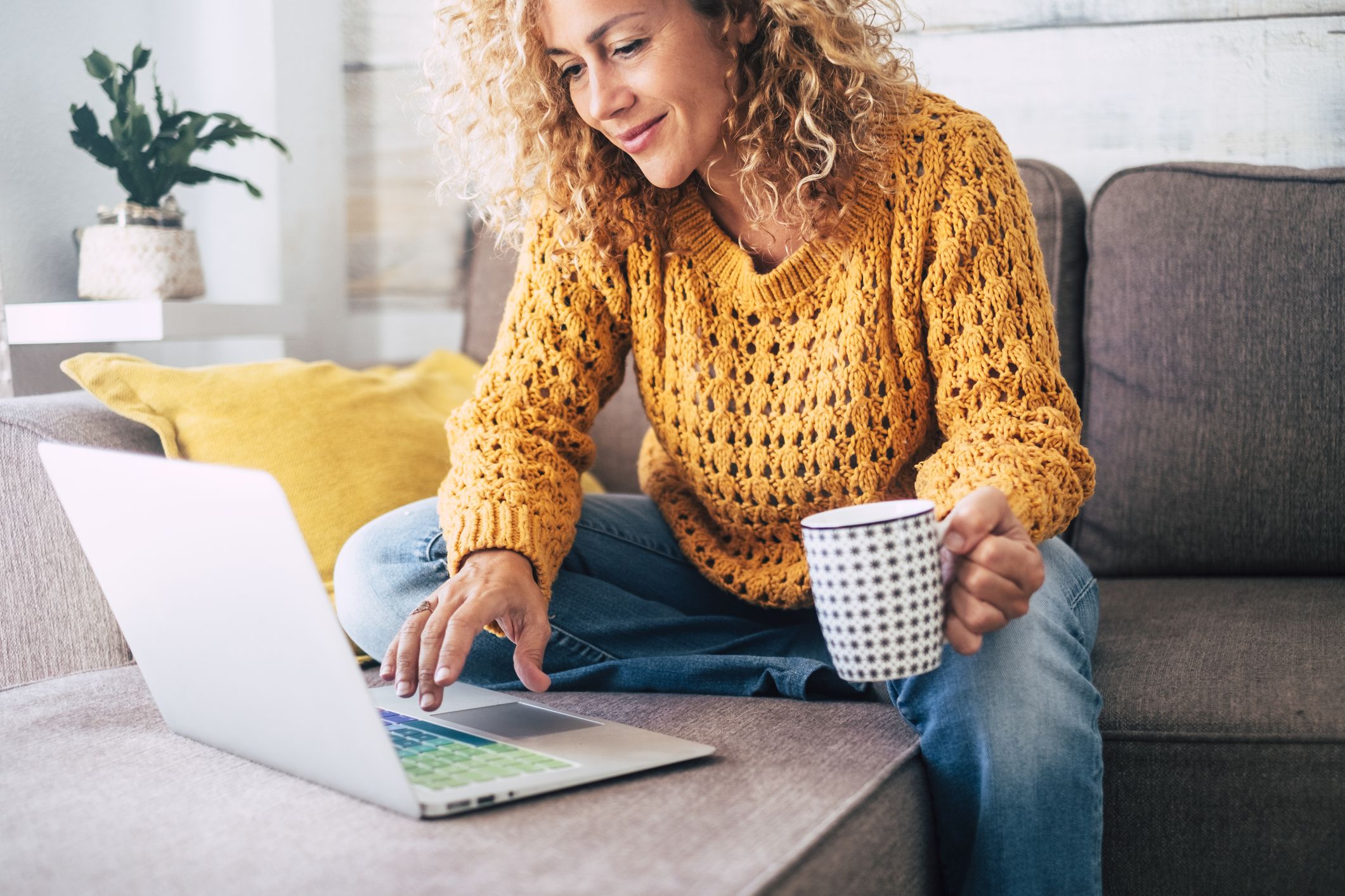 woman at home on computer bb58becb792640da8475f2f801c518ab