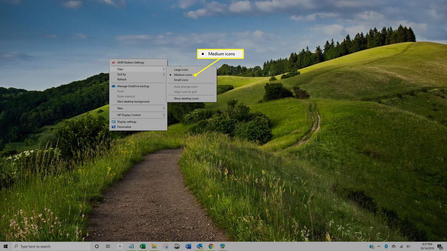 Windows 10 -työpöytä, jossa keskikokoiset kuvakkeet on valittu avattavasta valikosta
